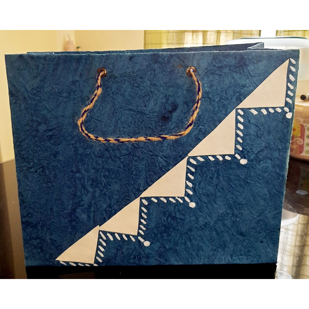 BLUE WITH TRIANGULAR DESIGN PAPER BAG